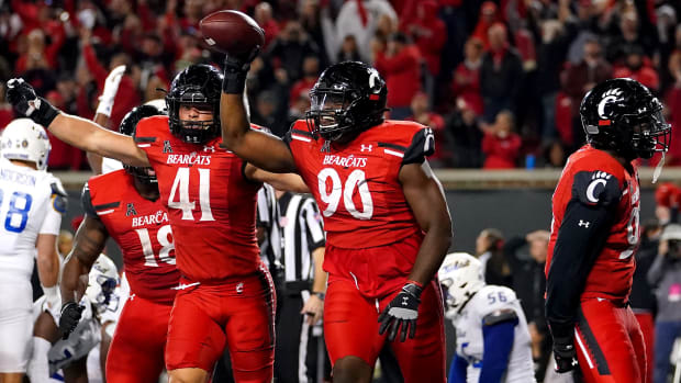 Cincinnati Bearcats defensive lineman Jabari Taylor (90)(90) celebrates after recovering a fumble in the end zone in the fourth quarter during an NCAA football game against the Tulsa Golden Hurricane, Saturday, Nov. 6, 2021, at Nippert Stadium in Cincinnati. The Cincinnati Bearcats won, 28-20. Tulsa Golden Hurricane At Cincinnati Bearcats Nov 6